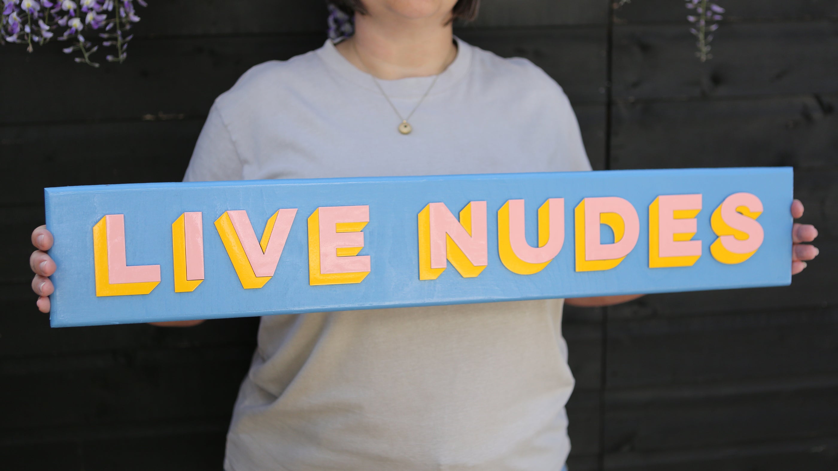 Person holding a sign with &